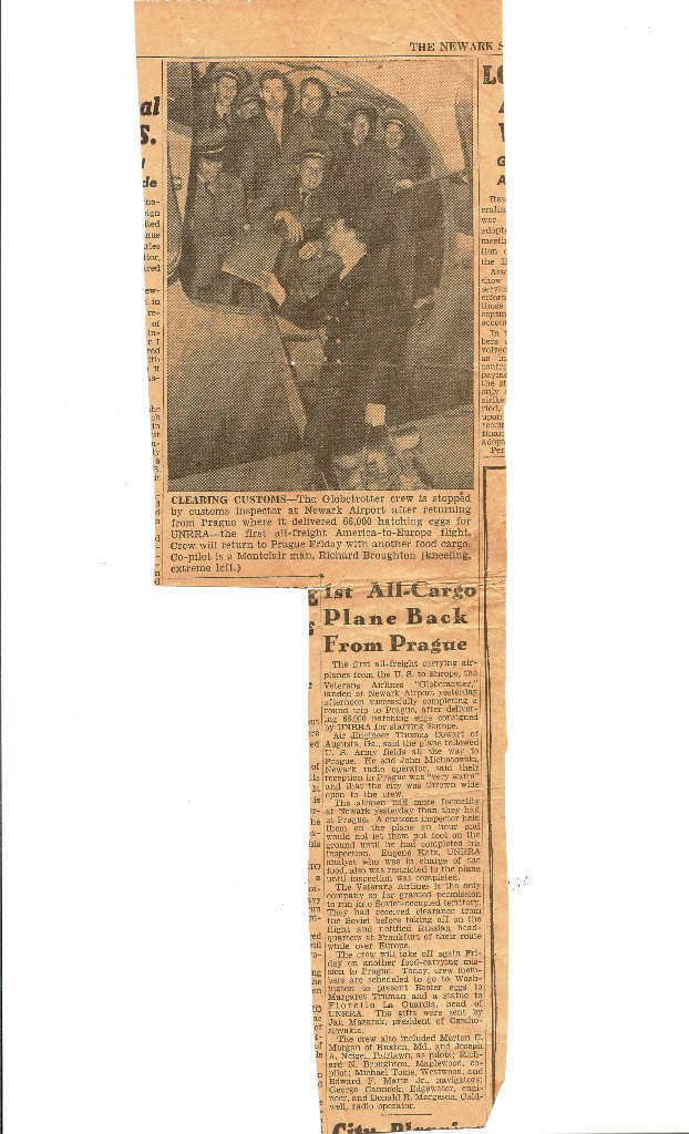 Newspaper story with photo of Veterans Air crew gathered at the open DC-4 cargo door being greeted by a U. S. Immigrations Office on a ladder leaned against the aircraft.
