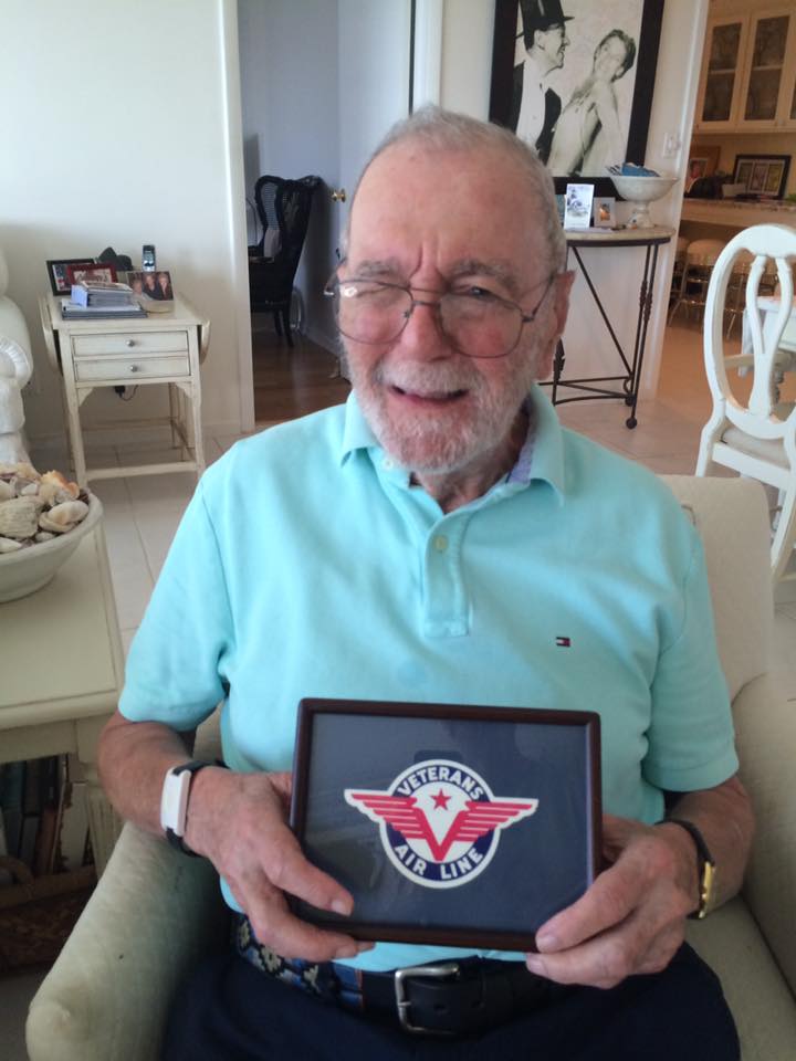 70+ years after co-founding and flying for the airline, Jack Stettner holds the Veterans Air Line logo.