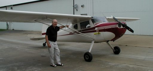 John Noll stands proud and tall next to a beautiful Cessna 120 that he brought back to life!