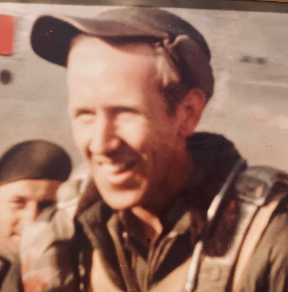 John (Jack) Noll in WWII flight gear smiling broadly upon return from 50th bombing mission in 1943. Two years later he help found Veterans Air Express.